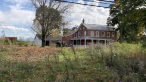 The historic Roswell Butler House in Essex, Vermont, with Camel's Hump in the distance